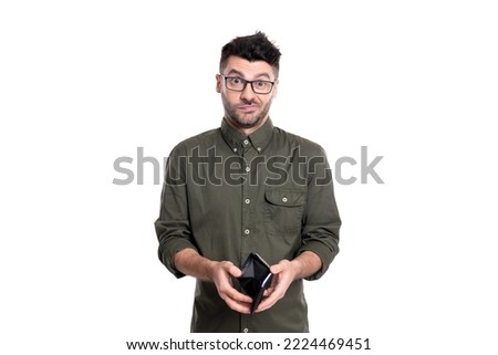 upset poor man with empty wallet isolated on white background. poor man hold wallet.