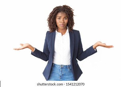 Upset Puzzled Businesswoman Making Do Not Know Gesture. Young Black Business Woman Standing Isolated Over White, Looking At Camera, Shrugging. Clueless Concept