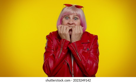 Upset Scared Frightened Elderly Stylish Rocker Granny Woman Biting Nails, Feeling Worried Nervous About Serious Troubles, Stress And Anxiety Disorder, Panic Attack, Guilty. Senior Old Grandmother