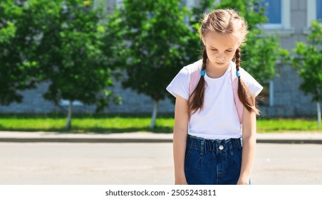 Upset school girl. Back to school. Child girl with backpack has bad emotions because of mark . Primary school - Powered by Shutterstock