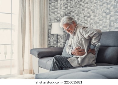 Upset senior elder man feel sudden back pain muscles ache tension injury sitting at home, sad old grandfather touching spine having lower lumbago backache osteoarthritis arthritis, backache concept - Powered by Shutterstock