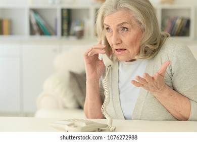 Upset Senior Woman With  Phone