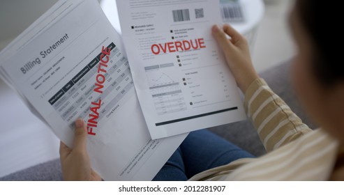 Upset Tired Young Asia Sad Lady People Sit Sofa Couch At Home Think Hard Worry In Tax Expense Saving Issue Past Due Loan Late Payment On Covid Impact Life Feel Grief Pensive Struggle In Money Lost.