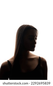 Upset woman backlit silhouette. Solitude contemplation. Portrait of insecure depressed tired sad woman face on white copy space background. - Shutterstock ID 2292695839
