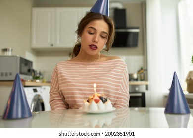 Upset Woman Sitting Alone In Home Kitchen. Freelancers Birthday Party Online. Frustrated Woman Waiting For Guests. Quarantine, Social Distancing And Stay At Home Concept