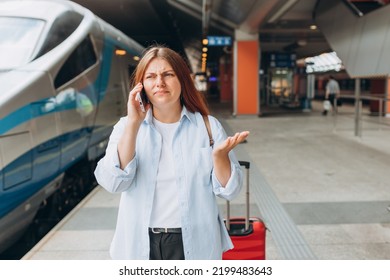 Upset Woman Talking Over Phone Disappointed Hear Bad News, Sad Pensive Girl Speaking Having Unpleasant Phone Conversation And Standing At Railroad Station Platform. Travel By Train. Negative Emotion