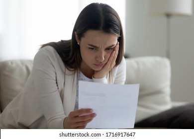 Upset Young Woman Feel Distressed Get Unpleasant Bad News In Paper Correspondence, Unhappy Sad Millennial Female Frustrated By Negative Letter Response, Receive Eviction Notice Or Payment Delay