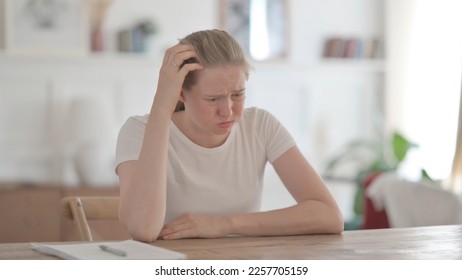 Upset Young Woman Feeling Worried While Sitting in Office - Shutterstock ID 2257705159