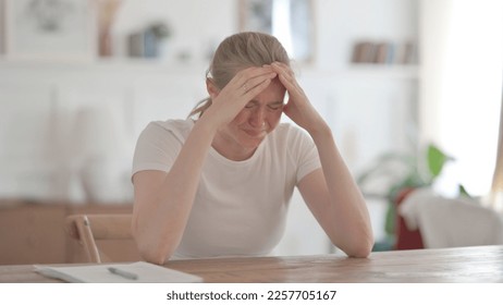 Upset Young Woman Feeling Worried While Sitting in Office - Shutterstock ID 2257705167