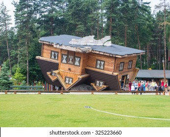 Upside Down House in Szymbark Poland. It stands on its roof and visitors walk on the ceilings and it is decorated in the socialist style of the 1970s.