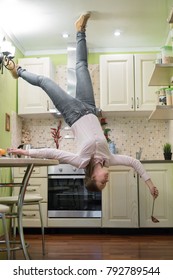 Upside down House. Woman on the kitchen.