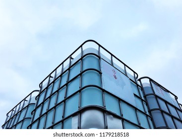 Upside View Of IBC Chemical Container Against A Blue Sky