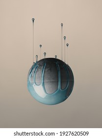 An upside-down of a gray ball with blue paint dripping upward isolated on pink background