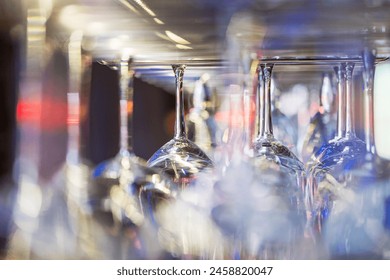 Upside-down wine glasses, sparkling clean, ready for service - Powered by Shutterstock