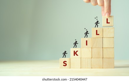 Upskilling and personal development concept. Skill training, education, learning, ability, knowledge and competency  for digital transformantion. Upskilling, reskilling, new skills icon on wooden cube