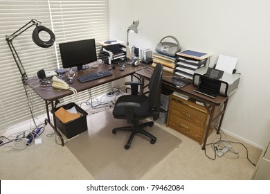 Upstairs Home Office With Chaos Of Cords.