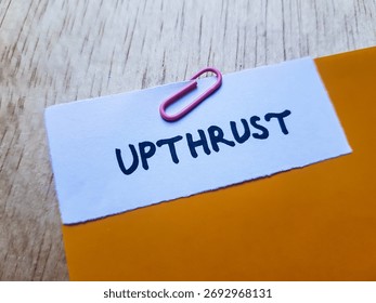 Upthrust writting on table background.