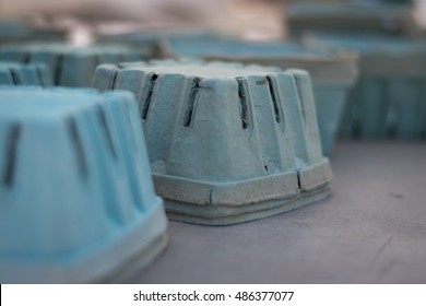 Upturned Blue Baskets On Farmstand Table