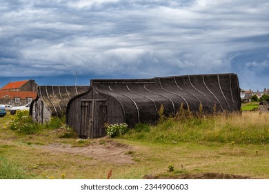 Upturned boats used as sheds on Lindisfarne
