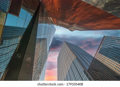 Upward Fish Eye View Of Tall Skyscrapers Against A Blue Sky In The Downtown Business Area.