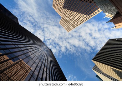 Upward Fish Eye View Of Tall Skyscrapers Against A Blue Sky In The Downtown Business Area Of Houston, Texas.