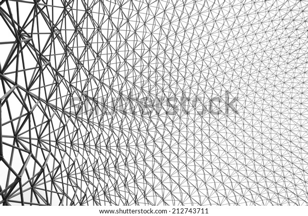 Upward image of the inside of a geodesic dome in\
black and white