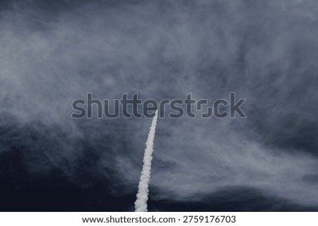upwards angle of rocket launch with trail