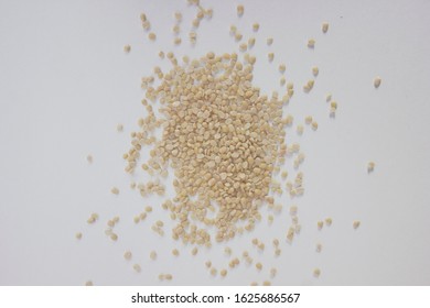 Urad Dal or Black Gram Split Pulse Unpolished Without Cover Also Know as Vigna Mungo, Black Gram, Urad Bean, Mungo Bean, Black Matpe Bean or Split Black Gram isolated on White Background