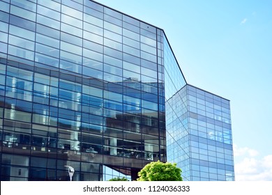 Urban abstract background, detail of modern glass facade, office business building. - Shutterstock ID 1124036333