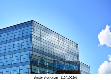 Urban abstract background, detail of modern glass facade, office business building. - Shutterstock ID 1124100266