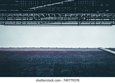 Urban alleyway view looking up. Street alley view of steel fire escape and brick building. Urban landscape. Street city building alleys. Minimal architecture design and detail. - Powered by Shutterstock