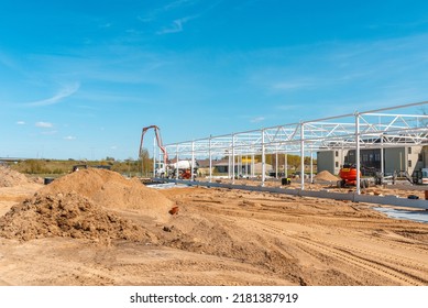 Urban Area With Machinery, People Are Working On Construction Site.Telsiai,Lithuania 05-10-2022.