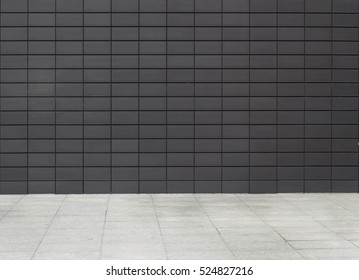 Urban Background Business Building Texture With Dark Metallic Plates Wall And White Sidewalk, Empty Setting, No People