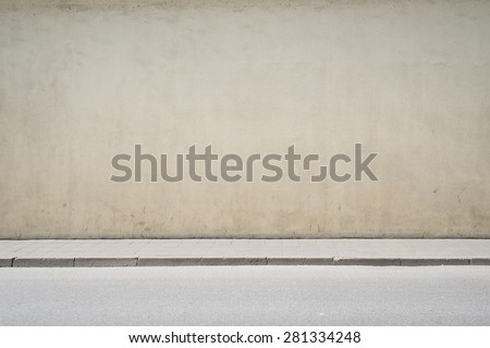 Urban background. Empty street wall and pavement 