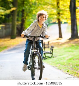 Urban Biking - Teenage Boy And Bike In City Park