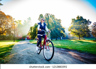 Urban Biking - Woman Riding Bike In City Park