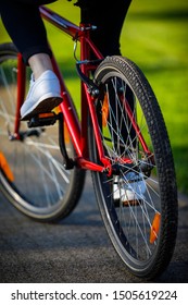 Urban biking - woman riding bike in city park - Shutterstock ID 1505619224