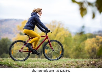 Urban Biking - Woman Riding Bike In City Park