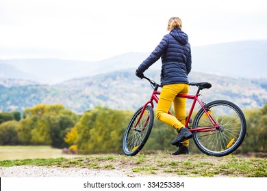 Urban Biking - Woman Riding Bike In City Park