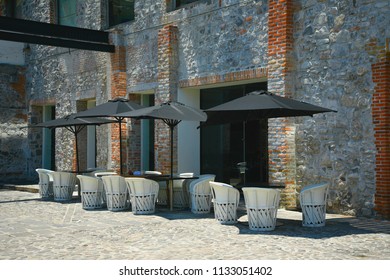 Urban Cafe With Stone Walls On A Quarry Tile Floor In Puebla, Mexico. 