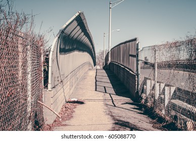 Urban chain link fence walkway. Industrial art and design. Overpass concrete bridge walkway.Black and white. Abstract art and design. Outdoor architectural detail and design. Abstract colors.  - Powered by Shutterstock