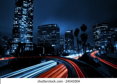 Urban City With Freeway Overpass Traffic, And Night Skyline,