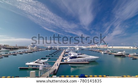 The urban cityscape timelapse hyperlapse. The city's waterfront, yacht in the sea port of Sochi 4K