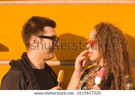 Similar – Smiling young woman looking at camera over sunglasses