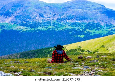 A Urban Cowboy Sitting Down And Taking In The View. 