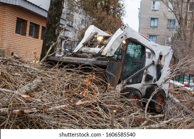 Urban Emergency Service Removes A Fallen Tree On A Road With Special Equipment Traktor