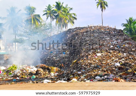 Urban environmental pollution. Solid waste being heaped in a locality within the city and is sometimes burnt leading to release of toxic gases. Unsustainable waste management.