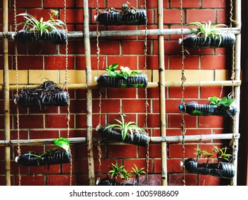 Urban Farming, Gardening Or Agriculture. Green Wall - Vertical Farming. A Wall With Flowerpots And Irrigating System