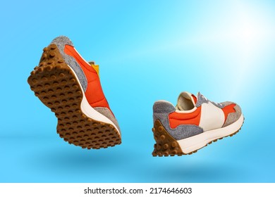 Urban Fashion Collection. Modern Sports Shoes Over Blue Background. Sneakers Or Trainers Isolated. Athletic Shoes. Fitness, Sport, Training Concept.Copy Space For Ad, Text, Design