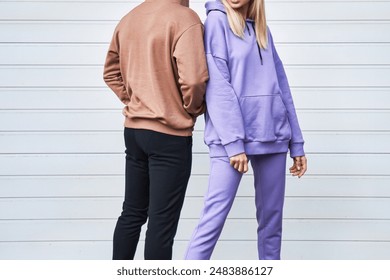 Urban Fashion Mockup with Couple in Plain Hoodies - Powered by Shutterstock